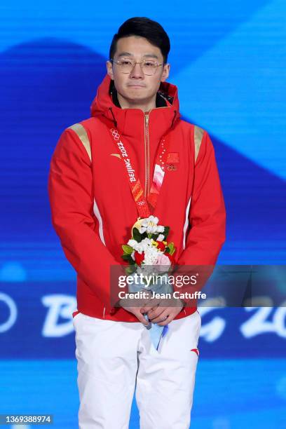 Gold medallist Ziwei Ren of Team China celebrates during the Men's 1000m Speed Skating medal ceremony on Day 4 of the Beijing 2022 Winter Olympic...