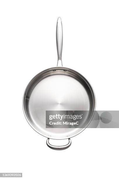 stainless steel cooking pan directly above on white - pfanne stock-fotos und bilder