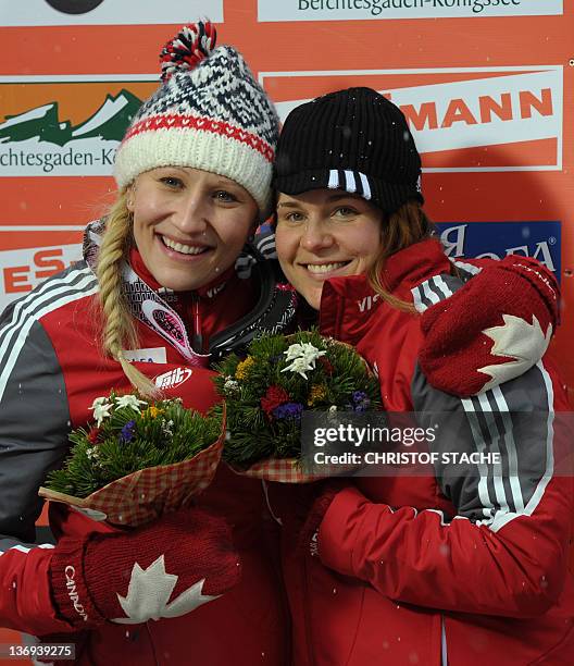 Canadian team Kaillie Humphries and Emily Baadsvik pose after the final race of the Women Bob World Cup race in Schoenau, southern Germany, on...