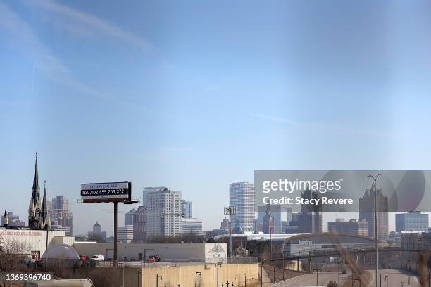 Billboard showing the national debt and each Americans share is displayed on February 08, 2022 in Milwaukee, Wisconsin. As of February 2022 the...