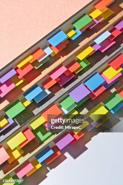 colorful bookmarks on stacked books - index cards notes stock pictures, royalty-free photos & images