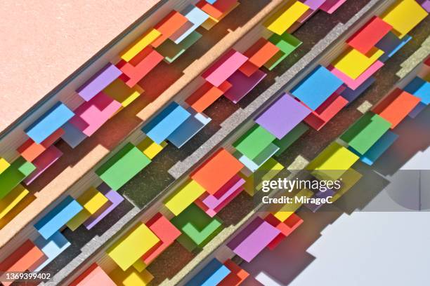 colorful bookmarks on stacked books - index cards notes stock pictures, royalty-free photos & images