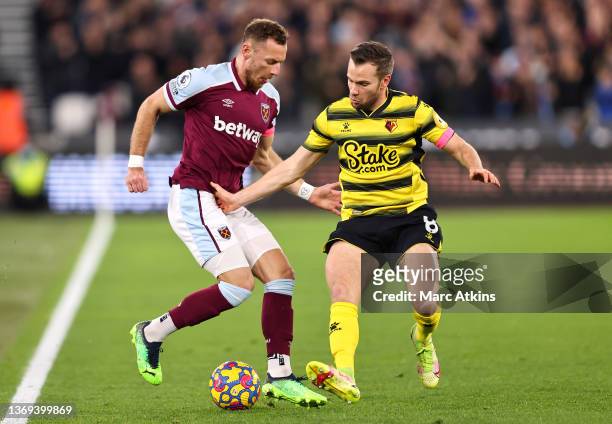 Vladimir Coufal of West Ham United battles for possession with Tom Cleverley of Watford FC during the Premier League match between West Ham United...