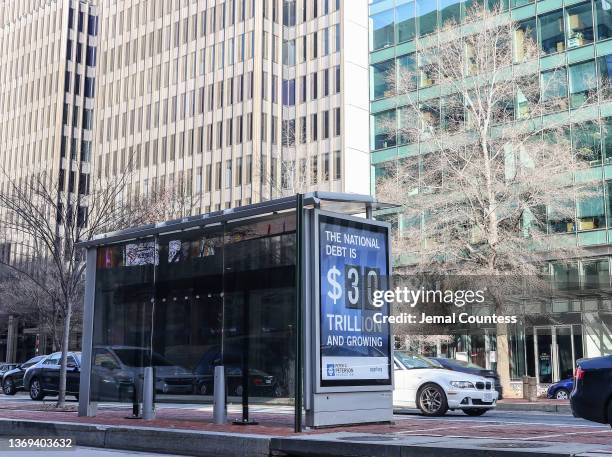 Peterson Foundation billboard displaying the national debt is pictured on K Street in downtown Washington DC on February 08, 2022 in Washington, DC....