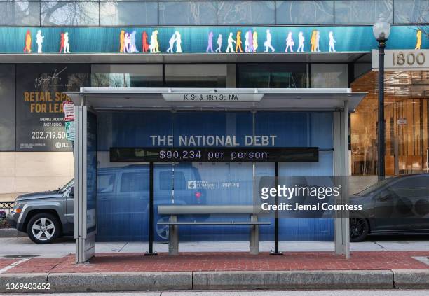 Peterson Foundation billboard displaying the national debt is pictured on K Street in downtown Washington DC on February 08, 2022 in Washington, DC....