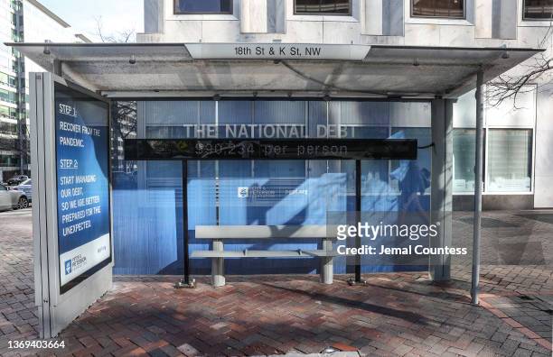 Peterson Foundation billboard displaying the national debt is pictured on 18th Street in downtown Washington DC on February 08, 2022 in Washington,...