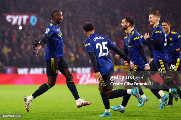 Paul Pogba of Manchester United celebrates with teammates after scoring their team's first goal during the Premier League match between Burnley and...