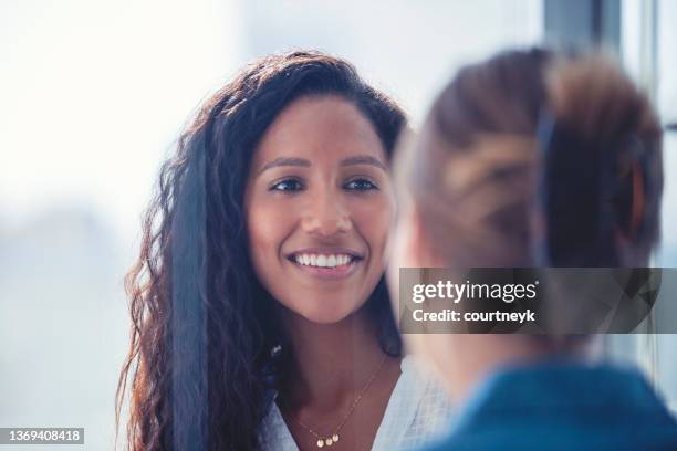 business colleagues having a conversation. - african american interview stock pictures, royalty-free photos & images