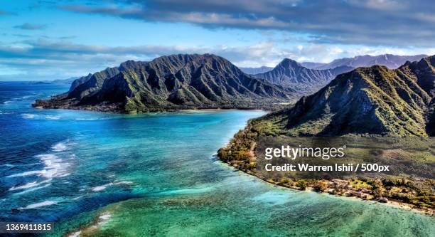 sun kissed peaks,scenic view of sea and mountains against sky,honolulu,hawaii,united states,usa - hawaii islands stock-fotos und bilder