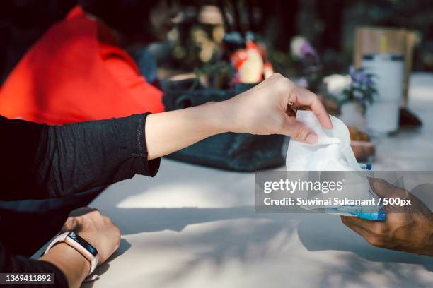 woman hand picked wet wipes in package health care and medicine - wet wipe stock pictures, royalty-free photos & images