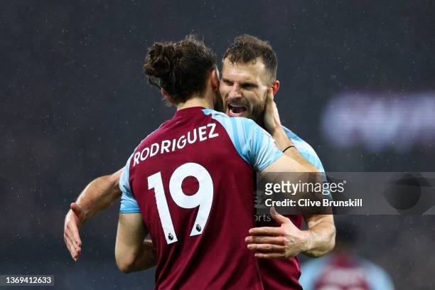Jay Rodriguez of Burnley is congratulated by Erik Pieters of Burnley after scoring their side's first goal during the Premier League match between...