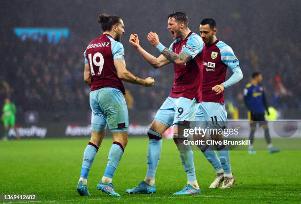 Jay Rodriguez of Burnley is congratulated by Wout Weghorst and Dwight McNeil of Burnley after scoring their side's first goal during the Premier...