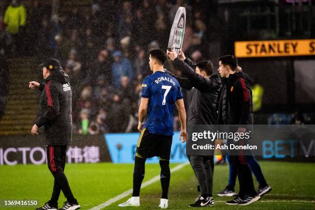 Cristiano Ronaldo of Manchester United waits to come on as a substitute during the Premier League match between Burnley and Manchester United at Turf...