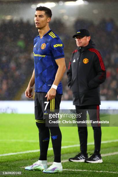 Cristiano Ronaldo of Manchester United prepares to enter the field as manager Ralf Rangnick looks on during the Premier League match between Burnley...