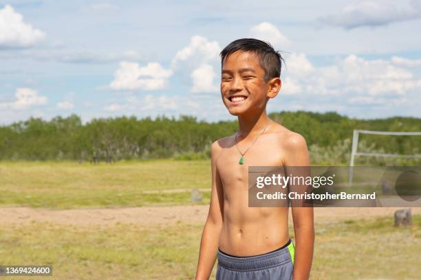 smiling asian boy at camping field - 13 year old cute boys stock pictures, royalty-free photos & images