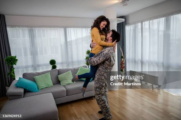 young military officer with his wife at home - police consoling stock pictures, royalty-free photos & images