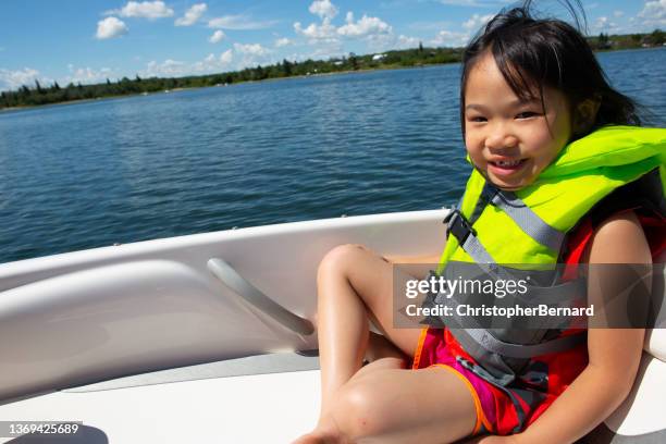 lake vacation fun - child life jacket stock pictures, royalty-free photos & images