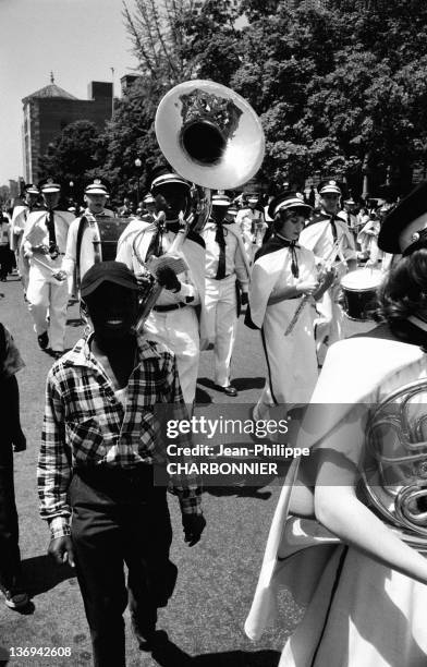 People in the streets looking at the Independence Day Parade in White Plains, July 4, 1958.