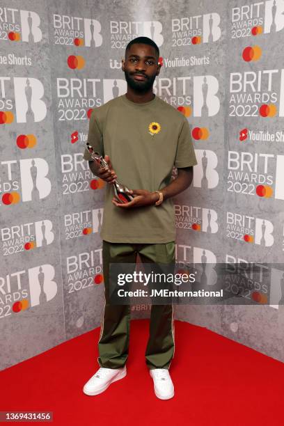 Dave poses with the award for Best Hip Hop / Rap / Grime Act in the media room during The BRIT Awards 2022 at The O2 Arena on February 08, 2022 in...