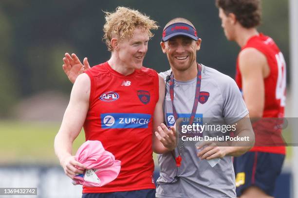 Clayton Oliver of the Demons and Demons head coach Simon Goodwin share a laugh during a Melbourne Demons AFL training session at Casey Fields on...