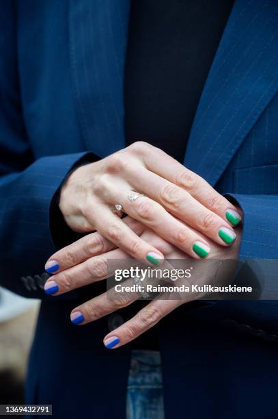 Close up of Emilia de Poret manicure, blue and green nails outside Teurn studios presentation in Stockholm fashion week Autumn/Winter 2022 on...