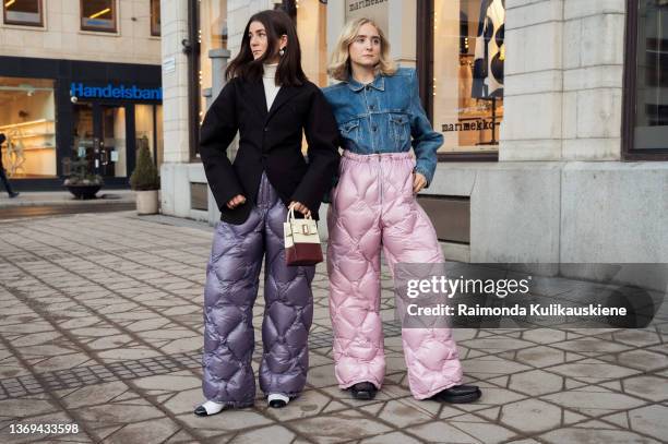 Linn Eklund and Fanny Ekstrand are seen wearing purple and pink Miu Miu quilted nylon pants outside Beckmans college of design show in Stockholm...