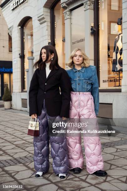 Linn Eklund and Fanny Ekstrand are seen wearing purple and pink Miu Miu quilted nylon pants outside Beckmans college of design show in Stockholm...