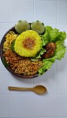 Nasi kuning or yellow rice.Indonesian traditional food