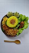 Nasi kuning or yellow rice.Indonesian traditional food