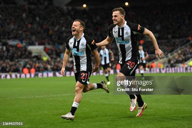 Newcastle player Ryan Fraser celebrates with Chris Wood after scoring the second Newcastle goal during the Premier League match between Newcastle...