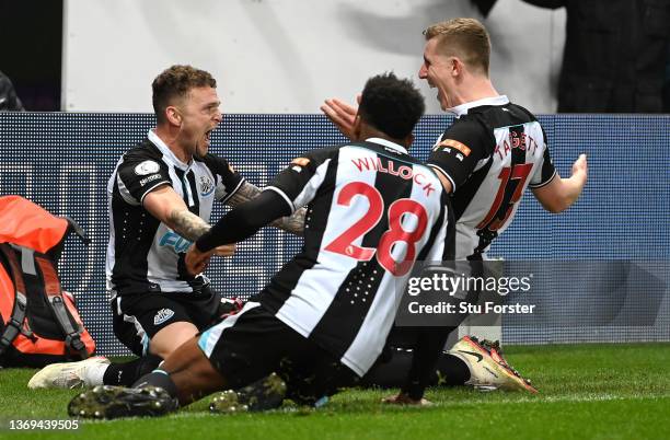 Newcastle player Kieran Trippier celebrates with team mates after scoring the third goal from a free kick during the Premier League match between...