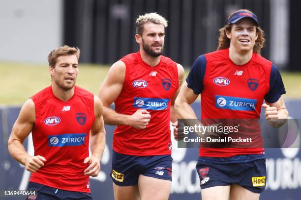 Jack Viney , Joel Smith and Ben Brown of the Demons in action during a Melbourne Demons AFL training session at Casey Fields on February 09, 2022 in...