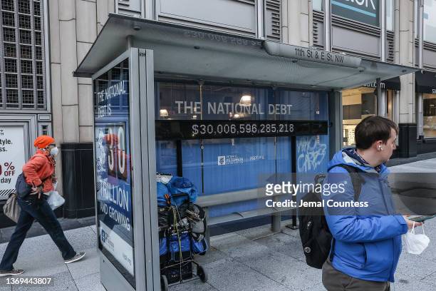 Peterson Foundation billboard displaying the national debt is pictured on 11th Street in downtown Washington DC on February 08, 2022 in Washington,...