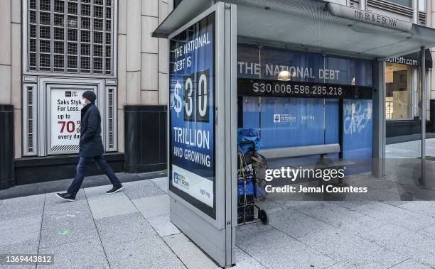 Peterson Foundation billboard displaying the national debt is pictured on 11th Street in downtown Washington DC on February 08, 2022 in Washington,...