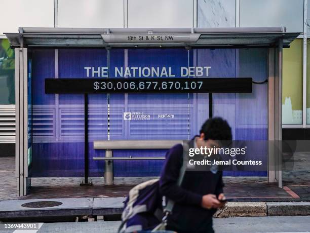 Peterson Foundation billboard displaying the national debt is pictured on 18th Street in downtown Washington DC on February 08, 2022 in Washington,...