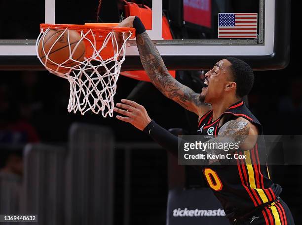 John Collins of the Atlanta Hawks dunks against the Indiana Pacers during the first half at State Farm Arena on February 08, 2022 in Atlanta,...