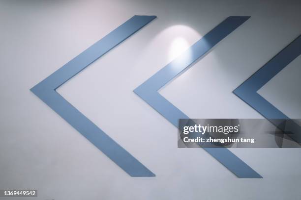 abstract concrete wall with arrow symbols - led texture stock pictures, royalty-free photos & images