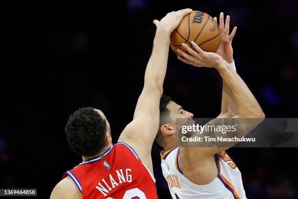 Georges Niang of the Philadelphia 76ers blocks Devin Booker of the Phoenix Suns during the third quarter at Wells Fargo Center on February 08, 2022...