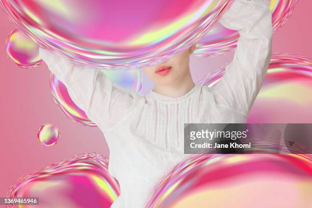 funny woman portrait in bubbles - people inside bubbles stock-fotos und bilder