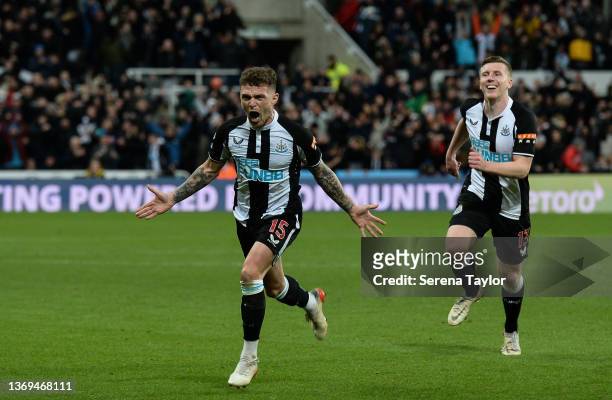 Kieran Trippier of Newcastle United celebrates with teammate Matt Targett after scoring the third goal from a Free Kick during the Premier League...