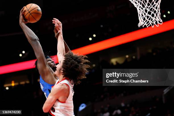 Mo Bamba of the Orlando Magic dunks over CJ Elleby of the Portland Trail Blazers during the second quarter at Moda Center on February 08, 2022 in...