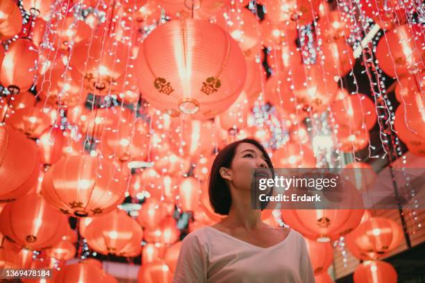 woman with shining lanterns background. - chinees lantaarnfeest stockfoto's en -beelden