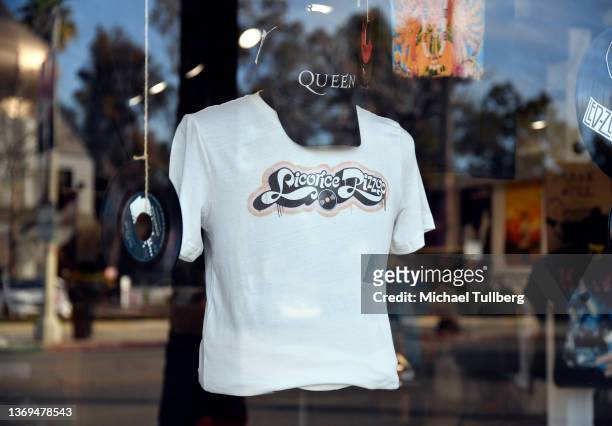 Queen baseball cap and a Licorice Pizza t-shirt in the front window display for the Licorice Pizza Records store on February 08, 2022 in Studio City,...