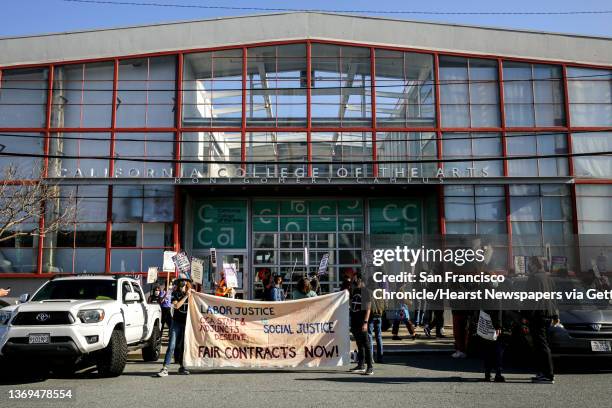 California College of the Arts' staff Matt Kennedy, center, strikes in protest of the school's unfair labor practices outside of its building in San...