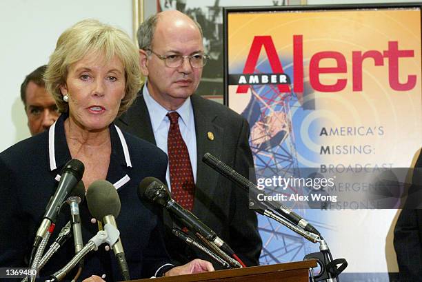 Rep. Jennifer Dunn speaks as Rep. Martin Frost listens during a news conference introducing the National AMBER Alert Network Act September 5, 2002 on...