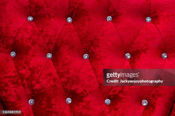 full frame shot of red velvet sofa - fringing ストックフォトと画像