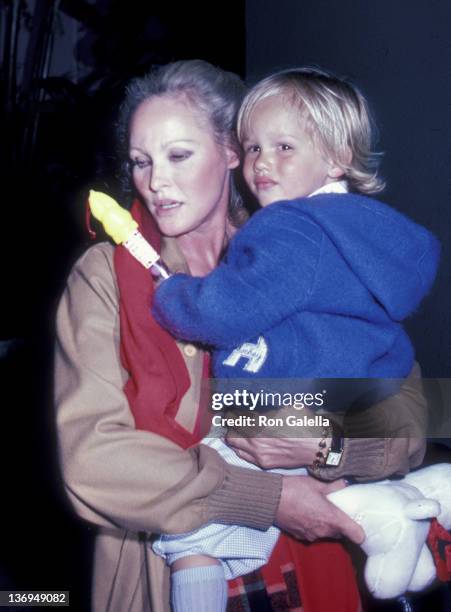 Ursula Andress and son Dimitri Hamlin attend Easter Sunday Brunch on April 11, 1982 at the Beverly Hills Hotel in Beverly Hills, California.