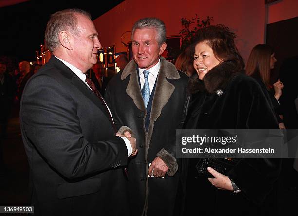 Uli Hoeness welcomes Jupp Heyncke and wife Iris at Uli Hoeness' 60th birthday celebration at Postpalast on January 13, 2012 in Munich, Germany.