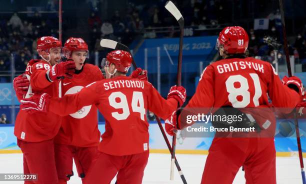 Anton Slepyshev of Team ROC celebrate with their team mates after scoring the opening goal in the first period during the Men's Preliminary Round...