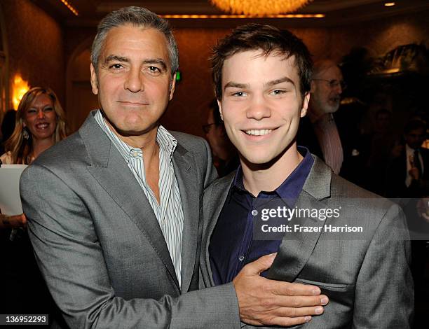 Director/actor George Clooney and actor Nick Krause attend at the 12th Annual AFI Awards held at the Four Seasons Hotel Los Angeles at Beverly Hills...